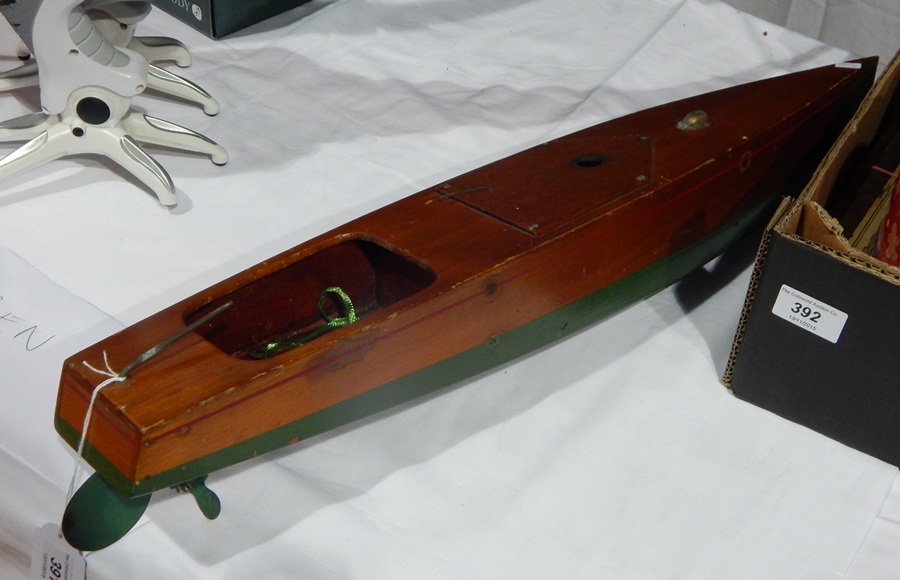 Early 20th century painted mahogany clockwork model speedboat, maker's mark "Kellner",