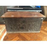 Early 18th century carved fruitwood chest, plain top with moulded edge,