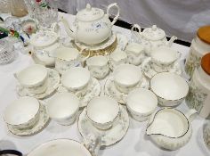 Wedgwood porcelain part tea service including one large and two smaller teapots, various cups,