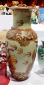 An Olpe shaped vase decorated with swallows and an oriental figure in battle dress and horse,