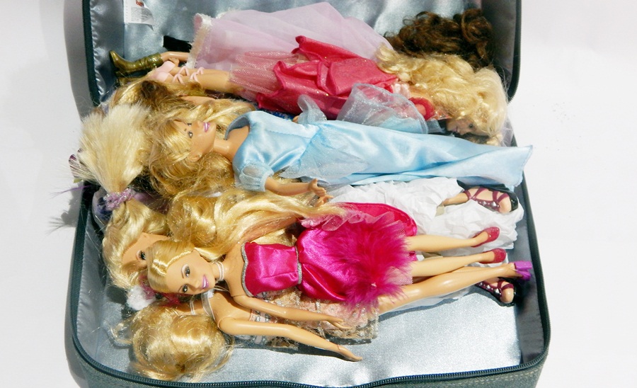 A quantity of Mattel Barbie and similar dolls in Bratz carrying case