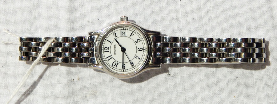 Lady's Tiffany stainless steel "Portfolio" style wrist watch with integral bracelet