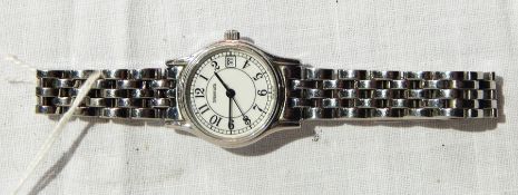 Lady's Tiffany stainless steel "Portfolio" style wrist watch with integral bracelet