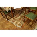 A Persian style rug with cream field and geometric stylised floral decoration,