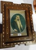 A Middle Eastern marquetry inlaid frame with mother-of-pearl inlay and a print of a Prince