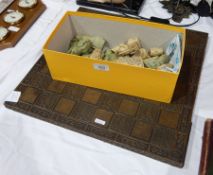 Soapstone chess pieces and a wooden chess board engraved with birds and scroll engraving