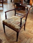 Matched set of Regency mahogany dining chairs with bar backs, upholstered stuff-over seats,