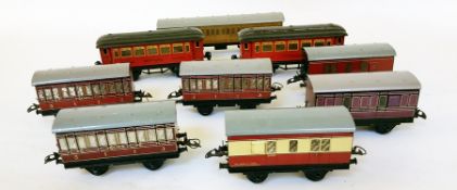 A Hornby 'O' gauge LNER 845 long passenger coach, three short LMS short passenger coaches,