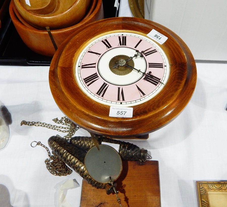 A postman's alarum clock with exposed drop pendulum and a pair of cone-shaped weights