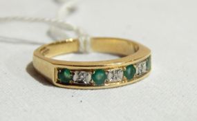 Seven-stone emerald and diamond half-eternity ring with 9ct shank