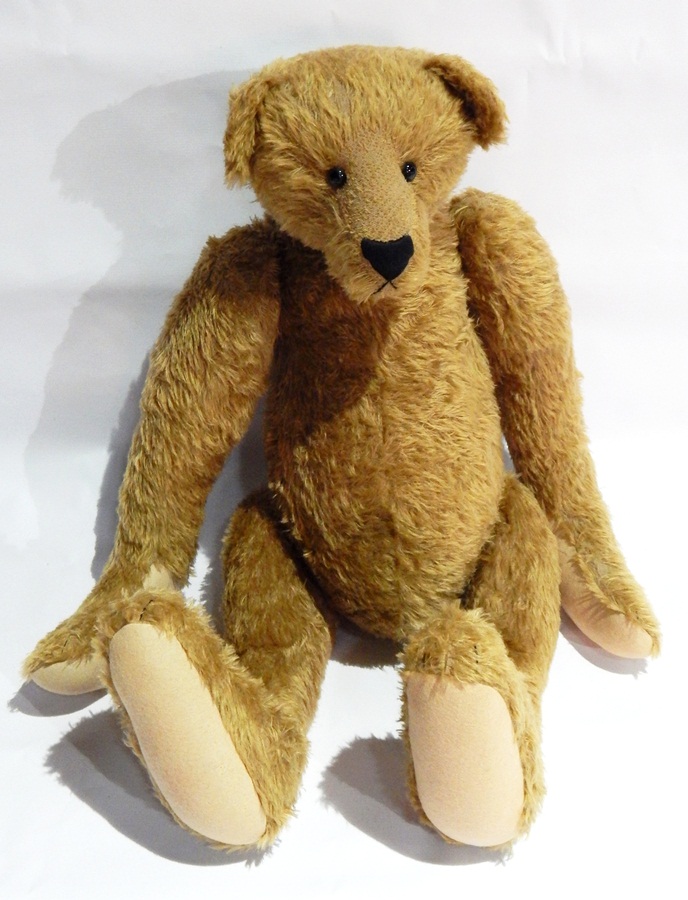 A collector's heavy bear by Blossom Bears, gold mohair, jointed body, long limbs, hump back,