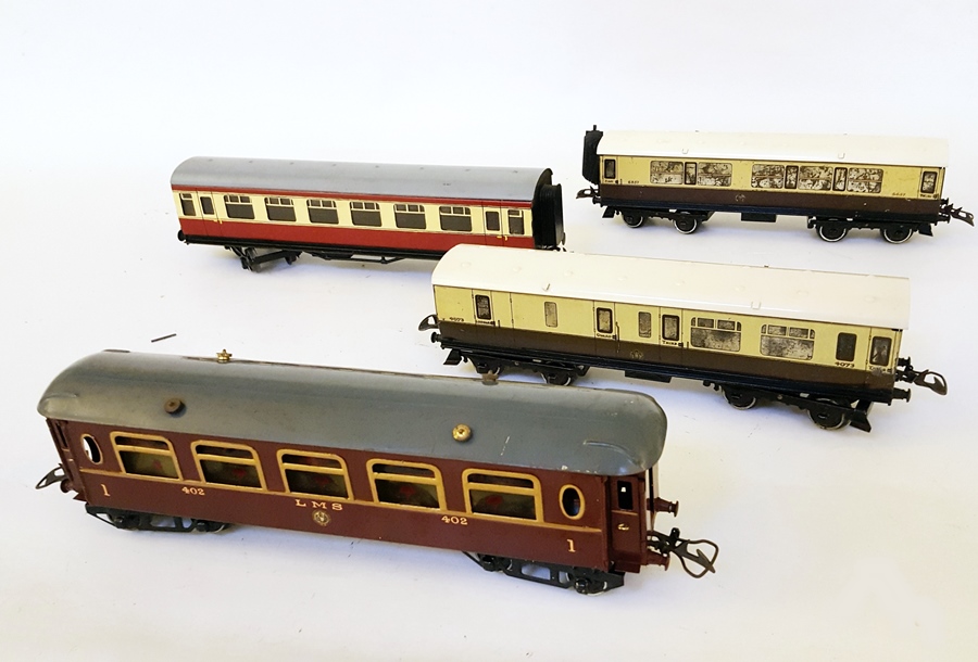 Three Hornby 'O' gauge passenger coaches and another by another maker