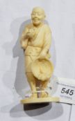 Japanese carved ivory figure of a man holding bird and basket with radish, on oval base, signed, 12.
