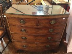 Late Georgian mahogany bow front chest of two short and three long graduated drawers on splayed