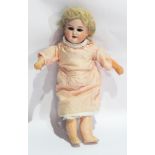 Bisque headed boy doll in Georgian dress with fixed brown eyes,