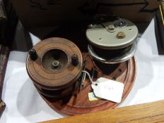 A wooden fly reel,