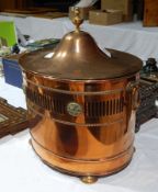 A copper coal scuttle with pierced banding and beaded decoration,
