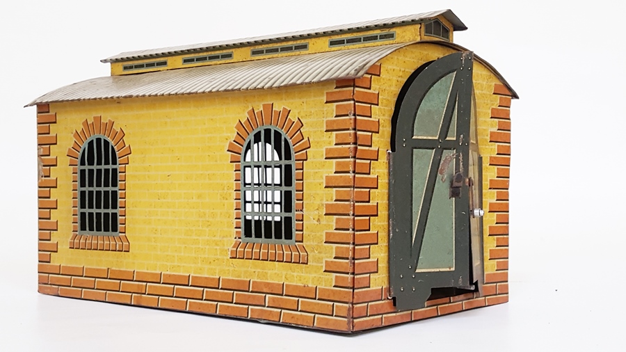 A Bing single road engine shed, brick-effect with two windows to each side,