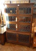 A Globe Wernicke style glazed sectional bookcase, with leaded lights enclosing shelves,