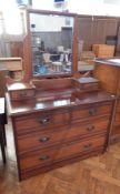 A late Victorian walnut mirror back dressing chest of drawers, a pair of trinket drawers,