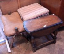 An oak oval flap top coffee table on turned legs,