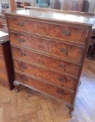 A Georgian style burr walnut veneer chest of five long drawers on short cabriole legs with pad feet,