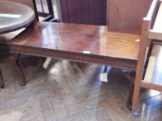 A modern mahogany rectangular top coffee table raised on cabriole legs with pad feet, width 84cm,