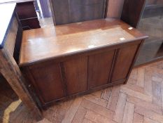 A modern oak blanket box, with panel front,