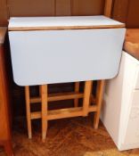 A formica top drop-flap kitchen table, width 60cm,