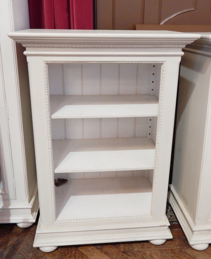 A matching open bookcase of three shelves,