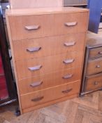 A modern oak chest of five long drawers,