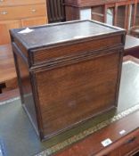 A 20th century oak cellarette with moulded borders,