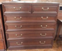 A modern mahogany chest of two short and four long drawers,