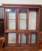 A Victorian pitch pine glazed bookcase with straight moulded corners,