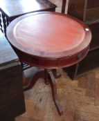 A modern drum shaped occasional table, with inset top, on pedestal support with tripod legs, dia.