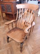 A Victorian beech and elm Windsor armchair with splat back, solid seat,