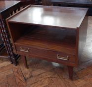 A modern telephone table, with rectangular top with open shelf below and frieze drawer,