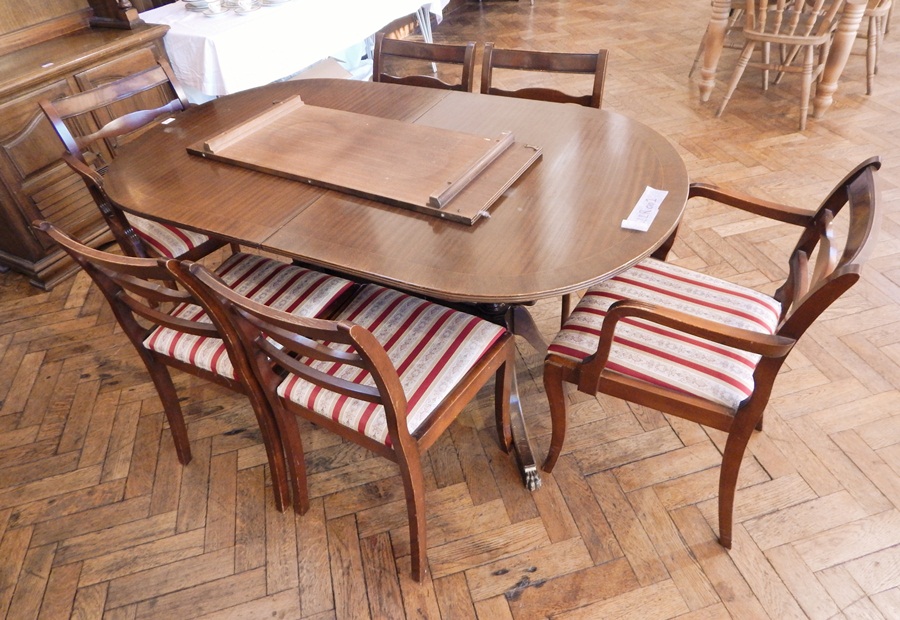 A mahogany reproduction twin pedestal dining table, with extra leaf, length 152cm,