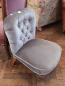 A small button back nursing chair on turned legs