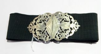 A white metal belt buckle of open foliate fretwork design (marks rubbed)