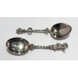 Two continental silver spoons with spiral handles and figure finials,