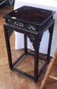 A Chinese black lacquer jardiniere stand, with open trelliswork frieze and brackets,