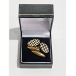 A pair of gentleman's 9ct gold oval cufflinks with enamel chequerwork design