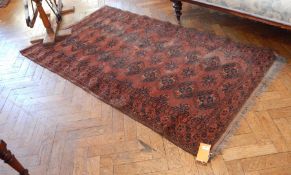 A Persian style wool rug,