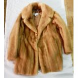 A pale mink jacket together with extra pieces