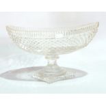 Late 19th/early 20th century cut glass oval pedestal dish, boat-shaped, on stepped rectangular base,