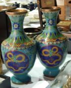 A pair of cloisonne vases decorated with dragon and floral scroll pattern