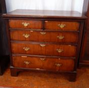 18th century walnut and oak chest of two short and three long graduated drawers on bracket feet,