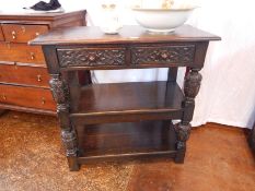 A Jacobean style carved oak buffet,