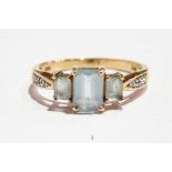 Blue and white stone dress ring set three aquamarine-coloured stones